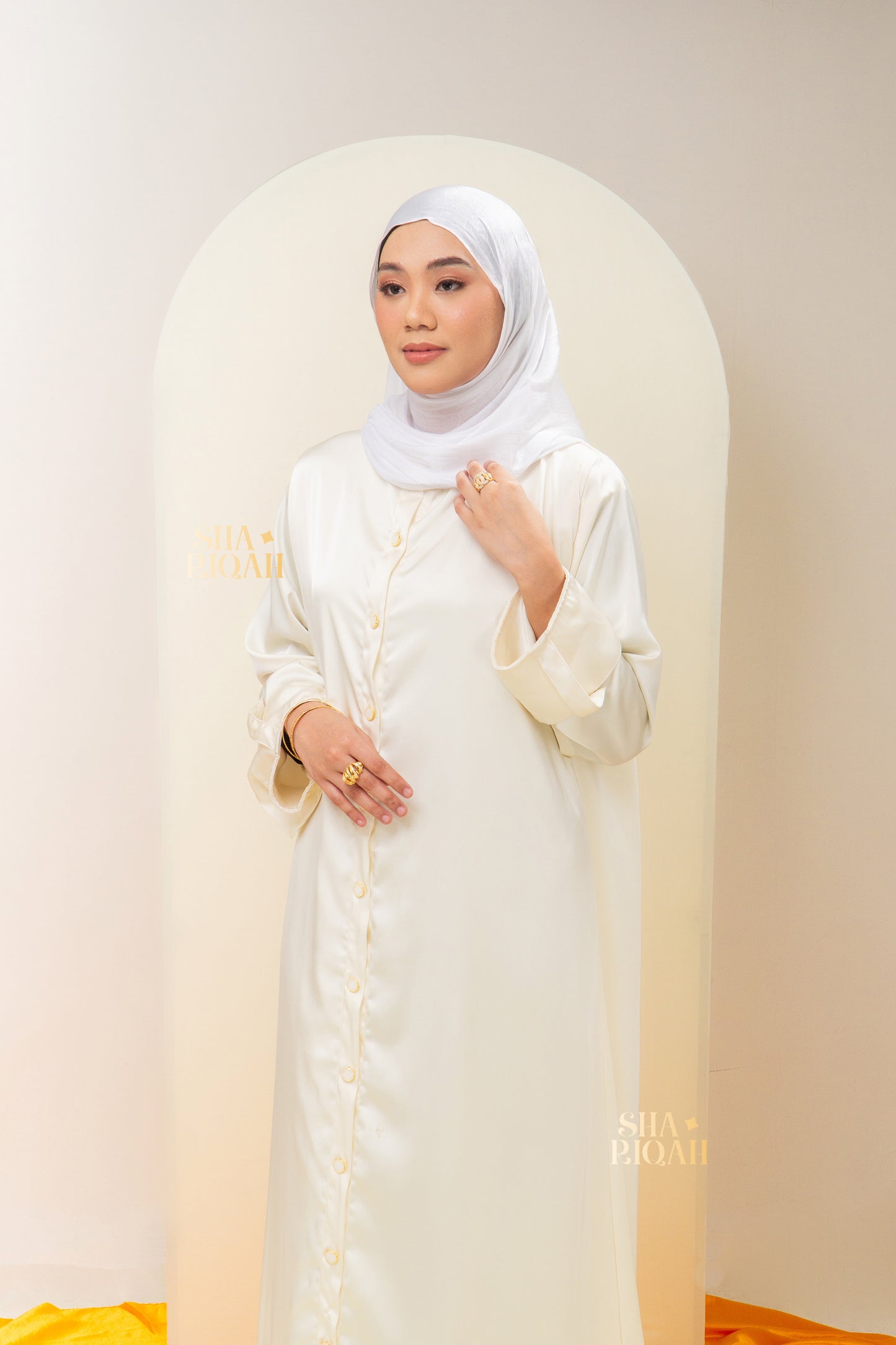 Qaaira Cardibaya in Cream White