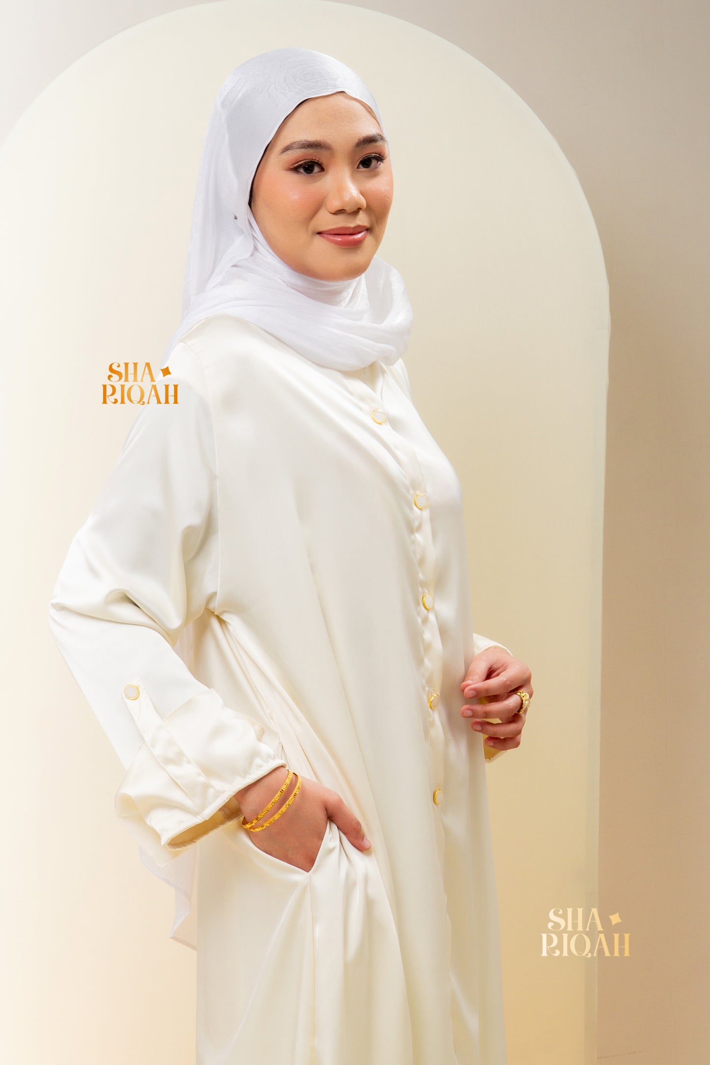 Qaaira Cardibaya in Cream White